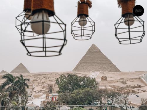 a collage of four photos of the pyramids at Giza Pyramids View Inn in Cairo