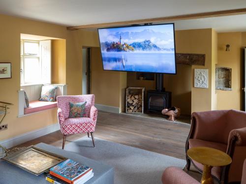 a living room with a flat screen tv on the wall at Enderley in Salisbury