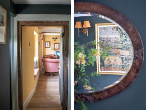 two pictures of a room with a mirror and a hallway at Enderley in Salisbury