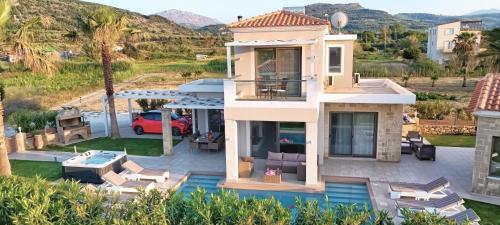 an aerial view of a house with a pool at Villa Alexandros in Kissamos