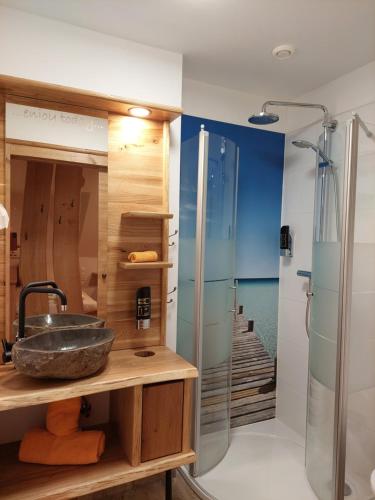 a bathroom with a sink and a shower at Gasthof Klug zum Ehrensepp in Modriach