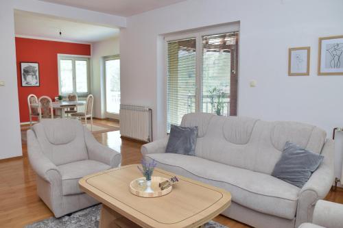a living room with a couch and two chairs and a table at Apartman Buongiorno in Jajce