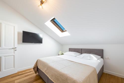 Voodi või voodid majutusasutuse Aria Suite & SPA Dubrovnik toas