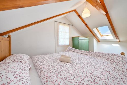 a bedroom with a bed with a box on it at Holiday Home Fančita in Tuheljske Toplice
