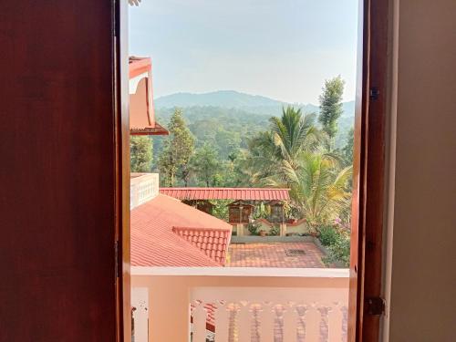 a view from a window of a building at Shivalaya Homestay, Madikeri in Siddapur
