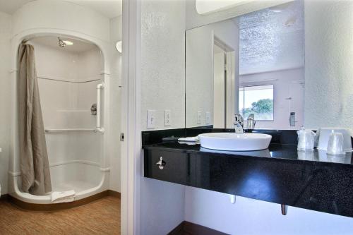 a bathroom with a sink and a shower at Motel 6-Abilene, TX in Abilene