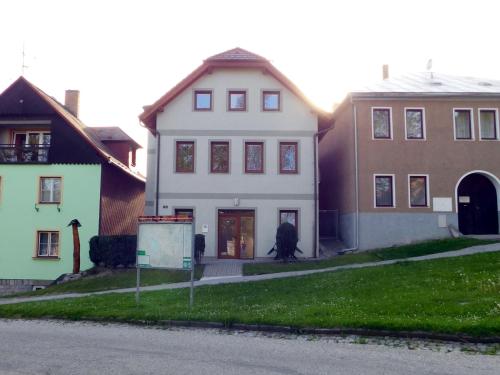 a group of houses on the side of a street at Apartmány Horní Planá in Horní Planá