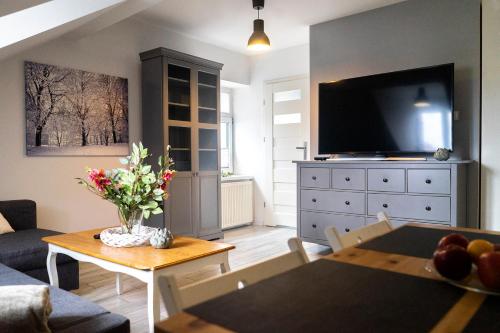Televisyen dan/atau pusat hiburan di Apartament Przy Podziemiach