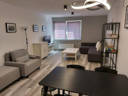 Posedenie v ubytovaní Uroczy apartament w ścisłym centrum Giżycka
