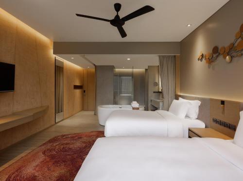 Ein Bett oder Betten in einem Zimmer der Unterkunft dusitD2 Khao Yai