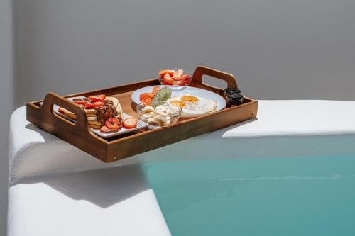 a tray of food on top of a table at Akrorama private villas and suites in Akrotiri