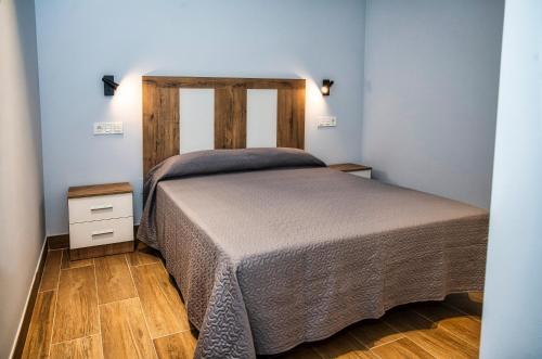 מיטה או מיטות בחדר ב-Casa Crego