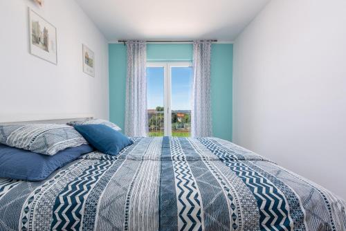 מיטה או מיטות בחדר ב-R&B Family Apartments