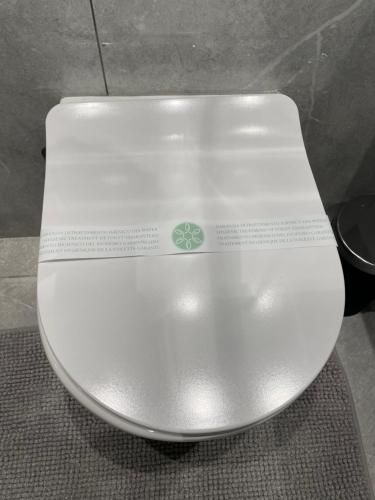 a close up of a white toilet in a bathroom at PALAZZO FIACCADORI - Historical Palace in Reggio Calabria