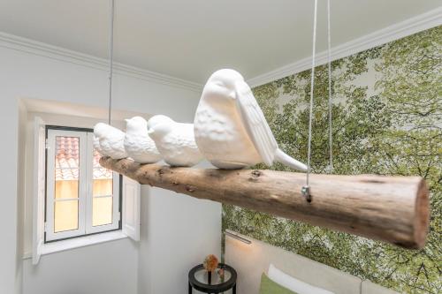 a piece of drift wood with a sculpture of a toothbrush at São José by SpotOn Apartments in Lisbon