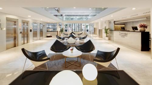 a dining room with chairs and tables in it at Sercotel Caspe in Barcelona
