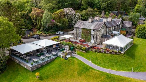 an aerial view of a house with a garden at Aberdunant Hall Holiday Park in Porthmadog