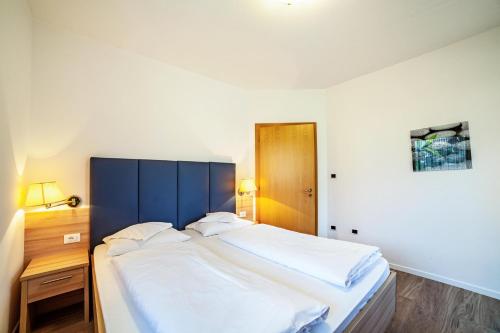 Postel nebo postele na pokoji v ubytování Gartenheim App Martin