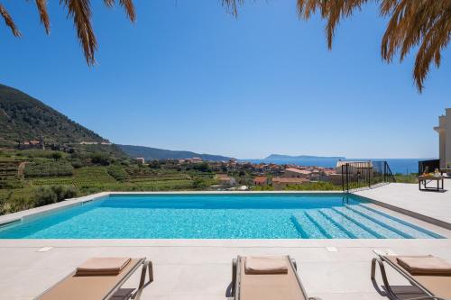 a swimming pool in a villa with a view at Luxury Villa Envivo Komiža with heated pool and professional gym in Komiža