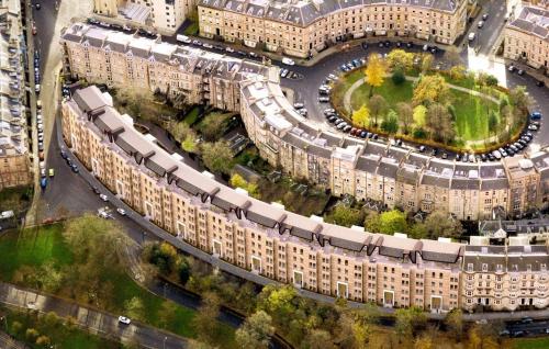 an overhead view of a city with large buildings at Stylish 2 Bedroom Apartment In Park Circus, West End in Glasgow