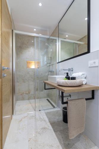 a bathroom with a sink and a shower at Villa Pafran with heated pool Krk in Krk