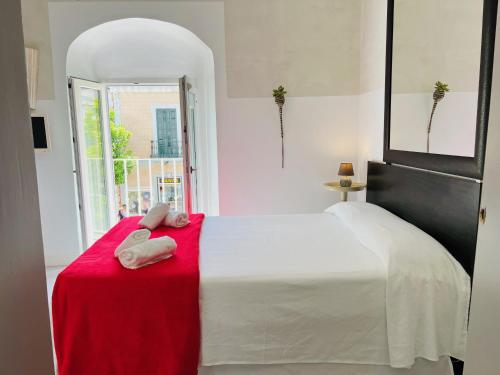 Posteľ alebo postele v izbe v ubytovaní Casa Blanco