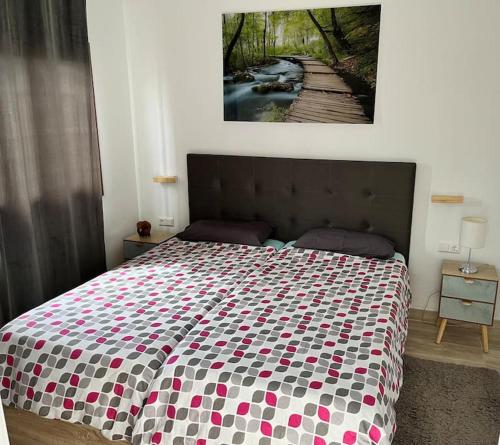 a bedroom with a bed with a colorful bedspread at Bungalow Yumbo in Playa del Ingles