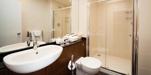 a bathroom with a sink and a toilet and a shower at Inverness Palace Hotel & Spa, WorldHotels Distinctive in Inverness