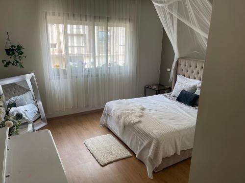 A bed or beds in a room at Chambre d'hôte close to the Airport MED 5 & market