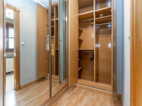 a walk in closet with a glass door at Casa Gallito, By DaiMar in Granada