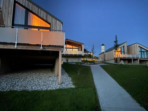 a house with a walkway in front of it at Waidlerland Chalet "Natur" in Mauth
