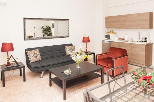 a living room with a couch and a table at Ioannis Apartments in Athens