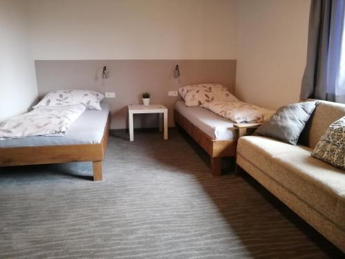 מיטה או מיטות בחדר ב-Gasthaus Schachinger