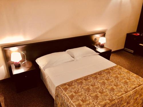 Ένα ή περισσότερα κρεβάτια σε δωμάτιο στο Hotel Malpensa INN Aereoporto