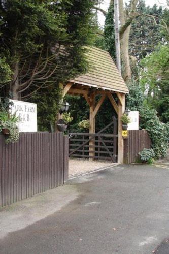 a gazebo with a sign in front of it at Park Farm in Windsor