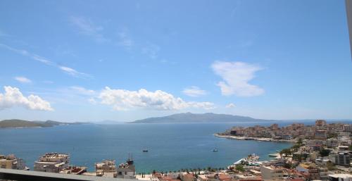 a view of a city and a large body of water at Olympia Hotel in Sarandë