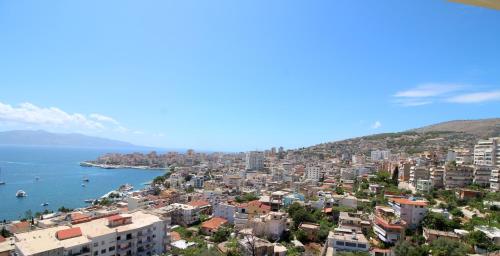 a view of a city and the ocean at Olympia Hotel in Sarandë