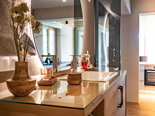 a bathroom with a sink and a mirror at Alpenchalet Vils Tirol in Vils