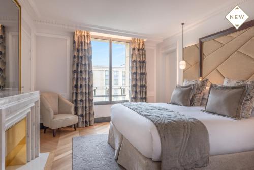 a bedroom with a large bed and a large window at Hotel du Collectionneur Arc de Triomphe in Paris