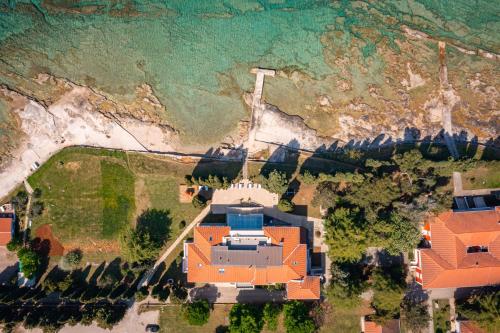 an aerial view of a house with the ocean at Villa Valdepian Apartments in Savudrija