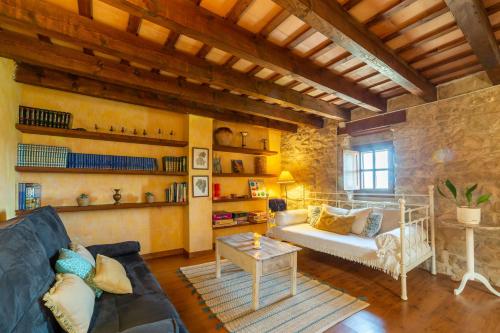 a living room with a couch and a table at Cal París Rural in La Donzell D'Urgell