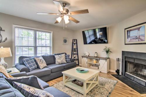 a living room with a couch and a fireplace at Water Access, Sunroom Ocean View Escape! in Ocean View