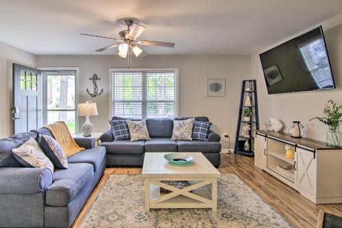a living room with a couch and a table at Water Access, Sunroom Ocean View Escape! in Ocean View