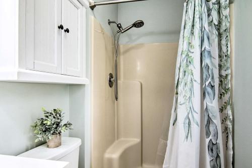 a shower in a bathroom with a shower curtain at Water Access, Sunroom Ocean View Escape! in Ocean View