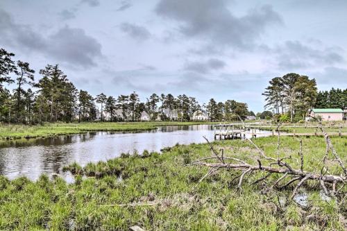 a river with a bridge in a field at Water Access, Sunroom Ocean View Escape! in Ocean View
