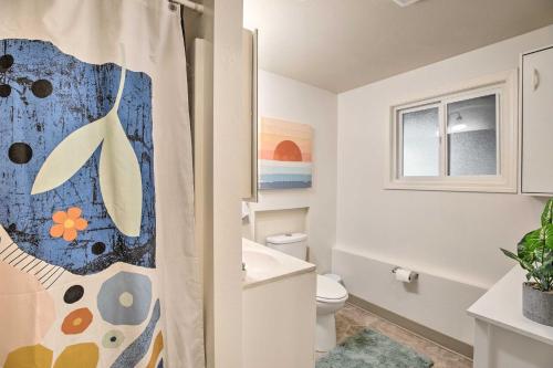 a bathroom with a toilet and a shower curtain at Rockaway Beach Condo - Beach Access Nearby! in Rockaway Beach