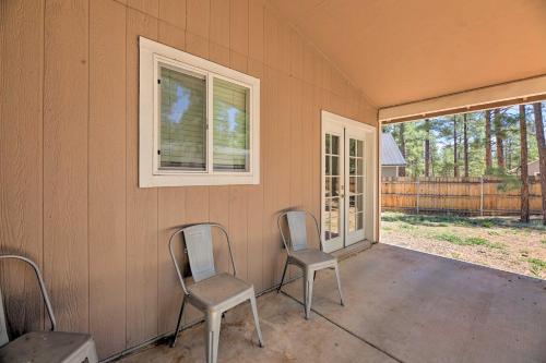two chairs sitting on a porch in a house at Fenced Yard, Fire Pit Quiet Show Low Home! in Show Low