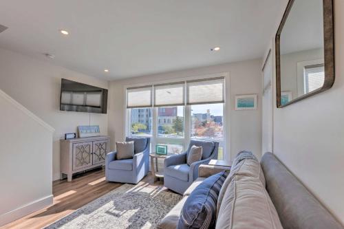 a living room with a couch and two chairs at Traverse City Townhome Walk to Beach! in Traverse City