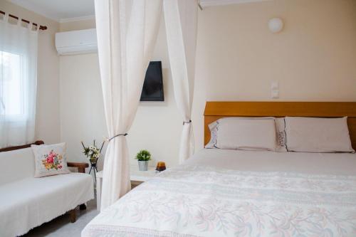 A bed or beds in a room at Maria's Little apartment