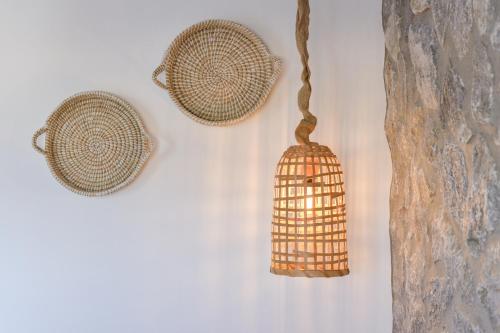 two baskets hanging on a wall at Hawk Stone in Adamas